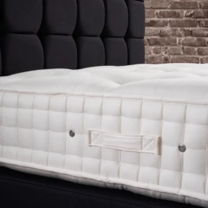 A detailed product description for the Hypnos Wool Origins 8 mattress. It highlights the mattress's generous wool content, ReActiveProโข spring system with Adaptivโข comfort springs, and double-sided design, along with dimensions, weight, and a 10-year guarantee.