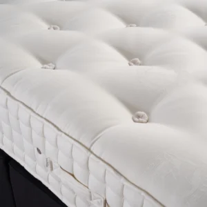 A detailed product description for the Hypnos Wool Origins 8 mattress. It highlights the mattress's generous wool content, ReActiveProโข spring system with Adaptivโข comfort springs, and double-sided design, along with dimensions, weight, and a 10-year guarantee.