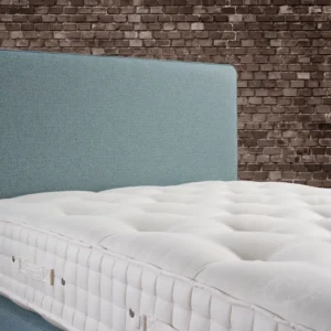 A detailed product description for the Hypnos Wool Origins 6 mattress. It highlights the mattress's generous wool content, ReActivePro™ spring system, and double-sided design, along with dimensions, weight, and a 10-year guarantee.