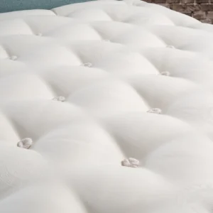 A detailed product description for the Hypnos Wool Origins 6 mattress. It highlights the mattress's generous wool content, ReActivePro™ spring system, and double-sided design, along with dimensions, weight, and a 10-year guarantee.