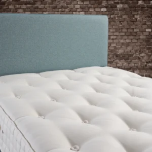 A detailed product description for the Hypnos Wool Origins 6 mattress. It highlights the mattress's generous wool content, ReActivePro™ spring system, and double-sided design, along with dimensions, weight, and a 10-year guarantee.