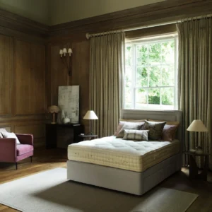 A detailed product description for the Hypnos Wool Origins 6 mattress. It highlights the mattress's generous wool content, ReActivePro™ spring system, and double-sided design, along with dimensions, weight, and a 10-year guarantee.