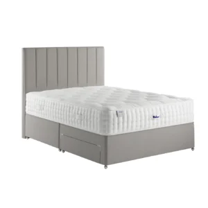A detailed product image showing the internal layers of the Luxury Alpaca 2550 mattress, including the pocket springs and natural alpaca-wool layers. The image also displays the full mattress on a divan base in a bedroom setting, highlighting its hand-tufted finish and a tag with "10" indicating a 10-year warranty.