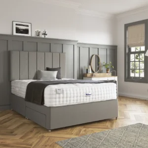 A detailed product image showing the internal layers of the Luxury Alpaca 2550 mattress, including the pocket springs and natural alpaca-wool layers. The image also displays the full mattress on a divan base in a bedroom setting, highlighting its hand-tufted finish and a tag with "10" indicating a 10-year warranty.