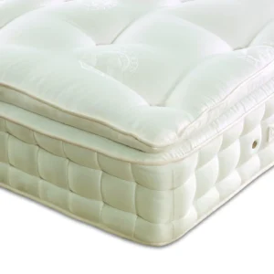 A visually detailed product description for the Hypnos Pillow Top Classic mattress, featuring a list of its high-quality natural and sustainable fillings, a 10-year guarantee, and tables for dimensions and weight. The description highlights the mattress's plush pillow top and ReActivePro™ spring system.