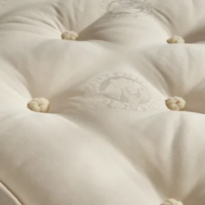 A visually detailed product description for the Hypnos Pillow Top Select mattress, featuring a list of its high-quality natural and sustainable fillings, a 10-year guarantee, and tables for dimensions and weight. The description highlights the mattress's plush pillow top and ReActiveProβ’ spring system.