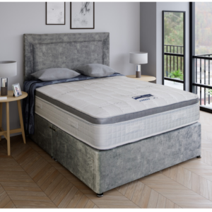 A close-up product image of the Hybrid Essential mattress, showing its soft quilted finish and diamond pattern. The fabric is a light, elegant colour, highlighting its premium quality and design.