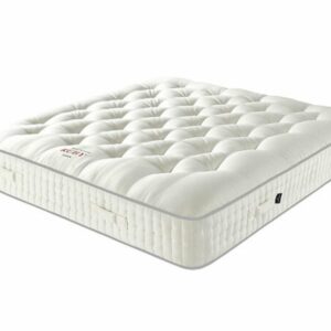 A screenshot of the Harrison Spinks Ruby 12,500 mattress product page. The images show a full mattress on a red divan base, a close-up of the mattress's quilting, and a list of key features including 12,500 springs and natural fillings.