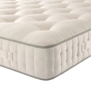 A screenshot of the Harrison Spinks Bronze Ortho 3,500 mattress product page. The images show a full mattress on a brown divan base, a close-up of the mattress's quilting, and a list of key features including 3,500 springs and natural fillings.