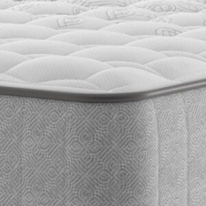 A full shot of the Chapman Extra Firm Mattress, shown on a matching divan base with a contemporary upholstered headboard. The mattress has a premium quilted white and grey top with the Sealy branding visible on the side panel.