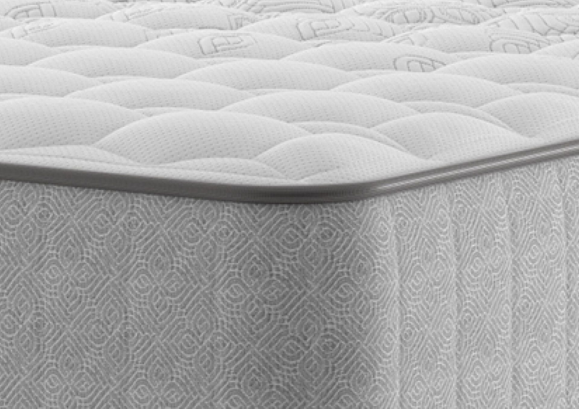 A full shot of the Chapman Extra Firm Mattress, shown on a matching divan base with a contemporary upholstered headboard. The mattress has a premium quilted white and grey top with the Sealy branding visible on the side panel.
