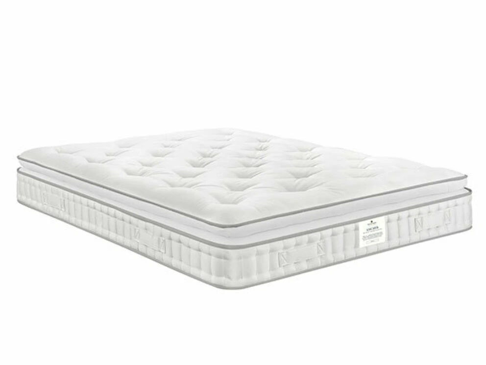 A screenshot of the Harrison Spinks Asscher Pillowtop 11,000 mattress product page. The images show a full mattress on a pink divan base, a close-up of the mattress's quilting, and a list of key features including 11,000 springs and natural fillings.
