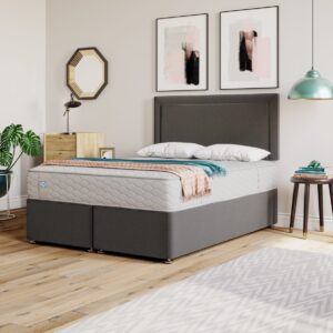 A screenshot of the Sealy Ottoman Divan Base product page. The image shows a bed with a Sealy mattress on a divan base with a headboard. A list of features including a full ottoman storage design, a StayTight™ lid fabric, and a 5-year guarantee is also visible.