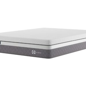 A full shot of the Hydra 2300 Hybrid Mattress, shown on a light grey divan base with drawers and a curved upholstered headboard, set in a contemporary bedroom. The mattress features a white top panel and a distinctive grey quilted side panel.