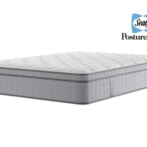 A luxurious shot of the Edison Luxury Plush Mattress, placed on a classic divan base with a curved upholstered headboard, featuring a large "NBF Awards - Bed Product of the Year" winner badge prominently displayed over the bed. The mattress has a deep quilted white top.
