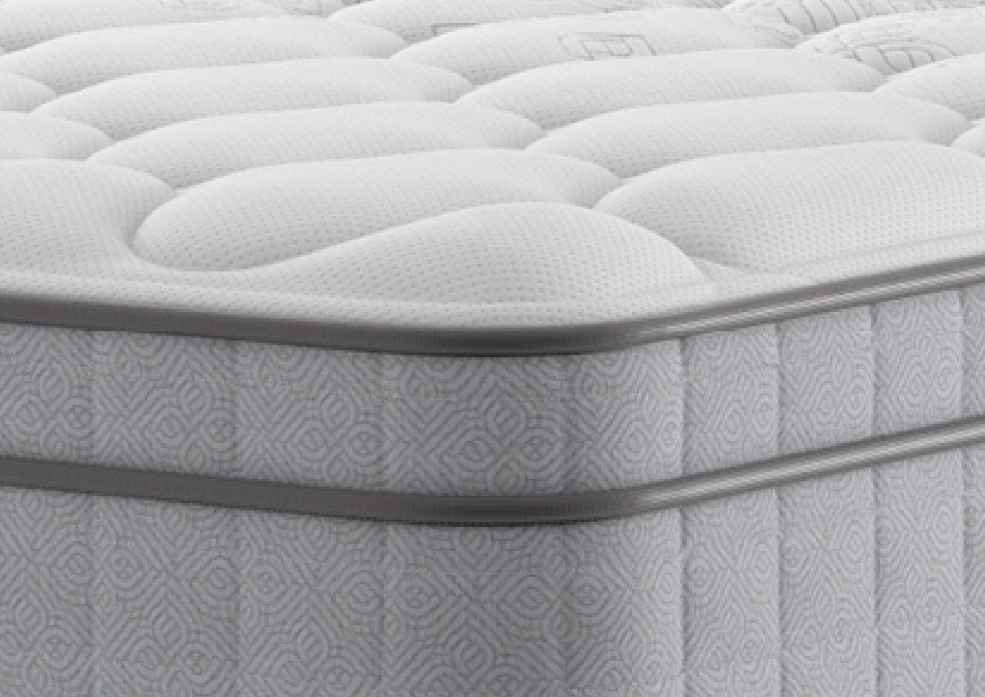 A luxurious shot of the Edison Luxury Plush Mattress, placed on a classic divan base with a curved upholstered headboard, featuring a large "NBF Awards - Bed Product of the Year" winner badge prominently displayed over the bed. The mattress has a deep quilted white top.