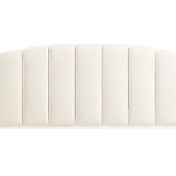 An elegantly upholstered domed headboard in a light, neutral-colored fabric, featuring cushioned vertical panels. The headboard is shown against a plain grey background.