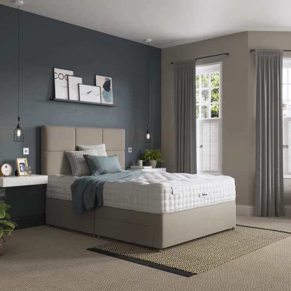 A detailed product image showing the internal layers of the Luxury Pashmina 2350 mattress, including the pocket springs and pashmina-wool layers. The image also displays the full mattress on a divan base in a bedroom setting, highlighting its hand-tufted finish and a tag with "10" indicating a 10-year warranty.