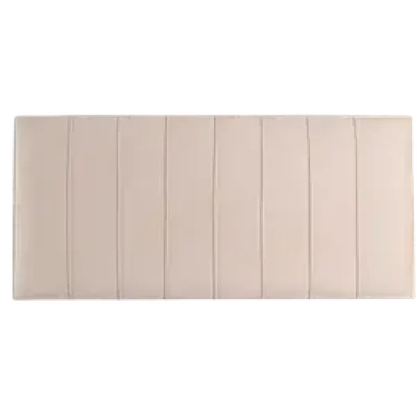A deeply upholstered headboard with vertical piped detail, shown in a light, neutral-colored fabric. The headboard is shown against a plain grey background.