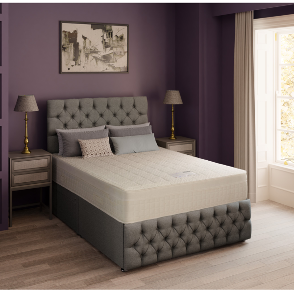 A detailed product image of the Sorrento mattress, showing a close-up of its deeply quilted surface and elegant white fabric. The mattress has a smooth, textured pattern, highlighting its quality and design.