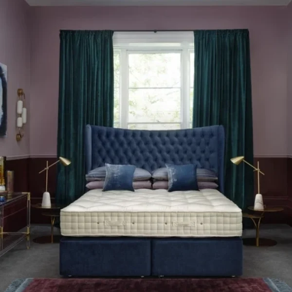 A visually detailed product description for the Hypnos Wool Origins 10 mattress, featuring a list of its high-quality natural fillings, a 10-year guarantee, and tables for dimensions and weight. The description highlights the mattress's generous wool content, ReActivePro™ spring system, and double-sided design.