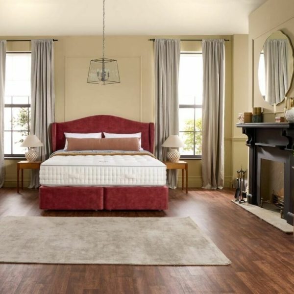 A screenshot of the Harrison Spinks Ruby 12,500 mattress product page. The images show a full mattress on a red divan base, a close-up of the mattress's quilting, and a list of key features including 12,500 springs and natural fillings.